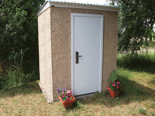 Popular concrete shed with fort knox door and two plants one either side of the door